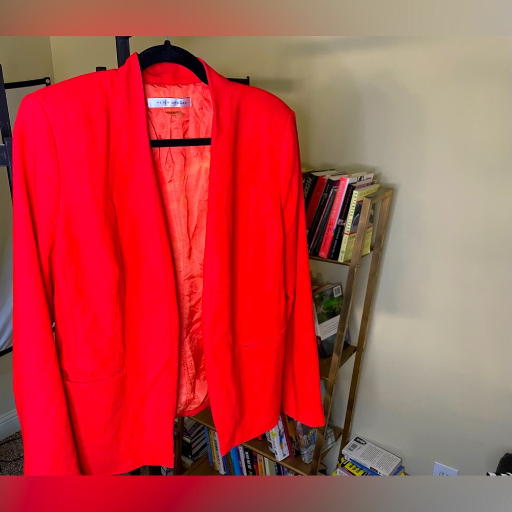 A blazer is a type of jacket resembling a suit jacket, but cut more casually.